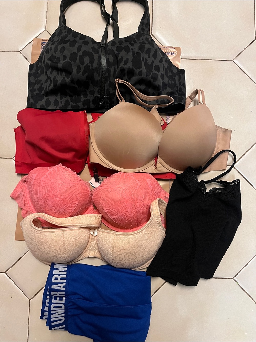Five Bras 36C, four are Victoria’s Secret; 1 black tank, 1UA Shorts. Pre Owned.